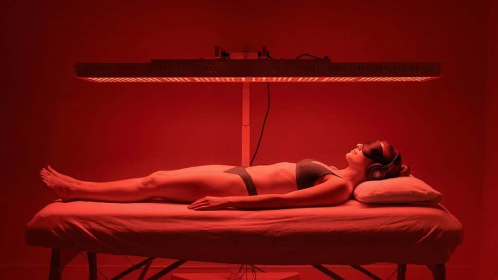 Woman relaxing during red light recovery session at Goji Yoga & Wellness Oakville